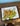 Lion on a green rock 