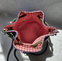 Image 4 of Padded bucket bag with an adjustable crossbody or shoulder strap.