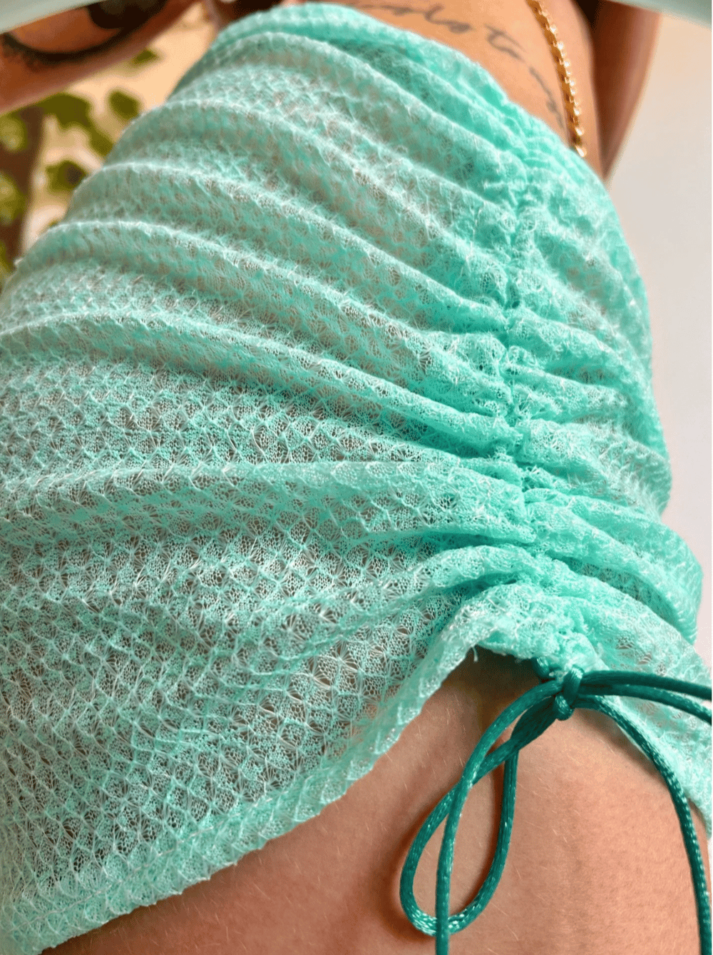 Image of the mint ruched mini skirt