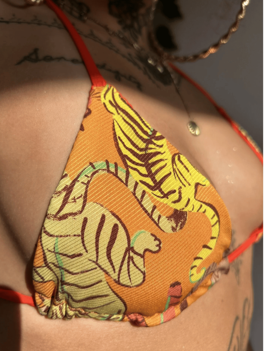 Image of the orange tiger reversible bikini top