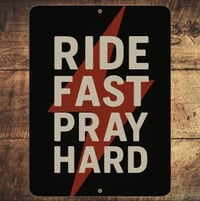 "RIDE FAST PRAY HARD" SHOP SIGN