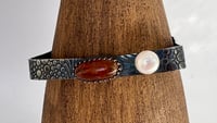 Image 2 of Blackened textured silver bangle with an amber gemstone and a freshwater pearl