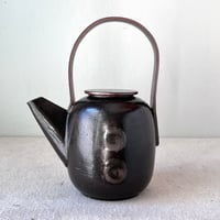 Image 1 of a black button teapot