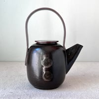 Image 3 of a black button teapot