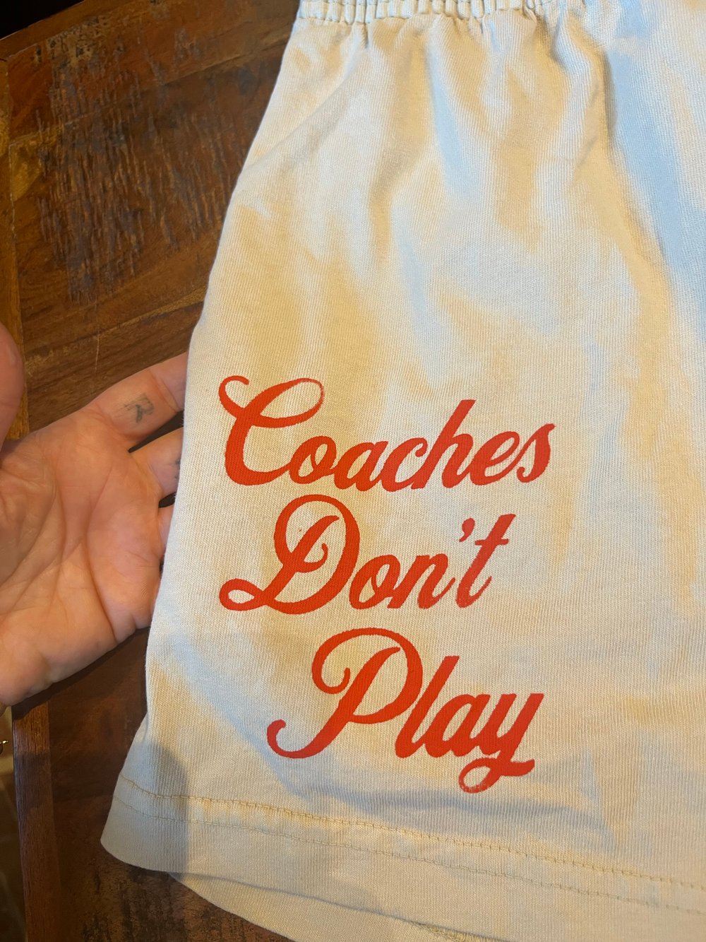 L TAN TALENTLESS SHORTS "COACHES DON'T PLAY"