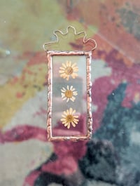 Image 1 of three flowers pressed botanical glass hanging