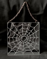 Engraved spiderweb mirror