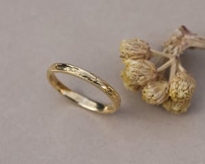 Image of 18ct Yellow gold, 2mm flat court Olive leaf and milled edge engraved ring
