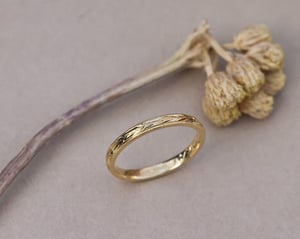 Image of 18ct Yellow gold, 2mm flat court Olive leaf and milled edge engraved ring