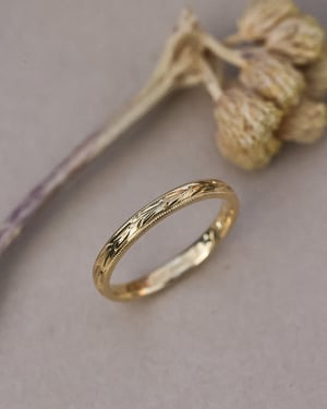 Image of 18ct Yellow gold, 2mm flat court Olive leaf and milled edge engraved ring