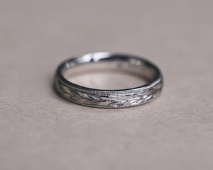 Image of Platinum 3mm ‘Olive leaf’ and milled edge engraved ring