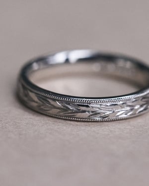 Image of Platinum 3mm ‘Olive leaf’ and milled edge engraved ring