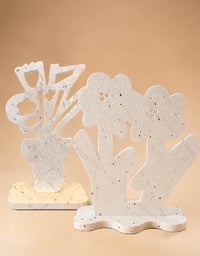 "Floral Sculptural Pairing of Sand Blasted Pepper Marble" by America Martin