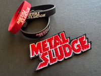 Image 1 of Metal Sludge 4-item Pack includes 1 Patch, 1 Leather Wrist Band & 2 Rubber Bracelets (3 Avail)