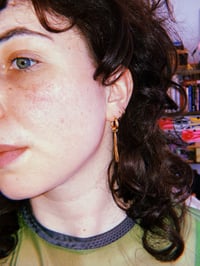 Image 1 of long gold drop