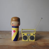 Image 1 of girl with an 80's boombox