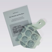 Image 1 of DO 2.2_The Tortoise and the Hare_Publication and Product (Powder blue and silver)