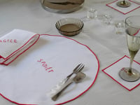 Image 1 of Hand Embroidered Word Round Placemat