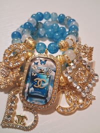 Image 1 of Blue clouds in gold