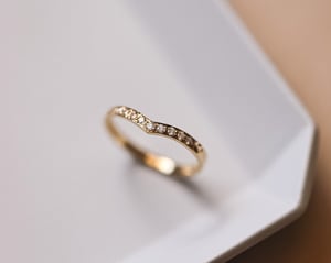 Image of 18ct Yellow gold white diamond set wishbone semi-eternity ring
