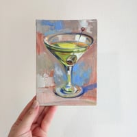 Image 1 of Сocktail in a clear glass with an olive. 