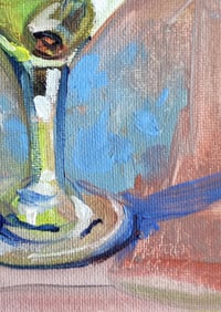 Image 4 of Сocktail in a clear glass with an olive. 