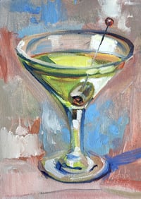 Image 2 of Сocktail in a clear glass with an olive. 