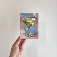 Image 5 of Сocktail in a clear glass with an olive. 