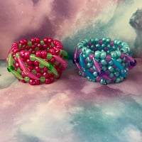 Image 1 of Spaghetti Twist GITD Kandi Cuff