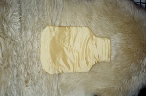Image of Silk covered hot water bottle, butter with stars