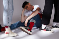 Why Fashion Lovers Are Obsessed With Comme des Garçons Hoodies, Shirts, and Sneakers Right Now