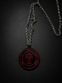 She Sells Sin medallion