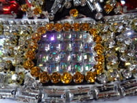 Image 3 of Red Crown May 2026 yellow and white diamonds
