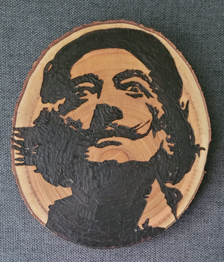 Image of Dail wood burning art piece 