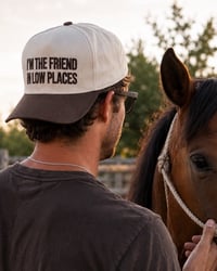 Image 1 of “I’m The Friend In Low Places” Embroidered Trucker Cap - UNISEX