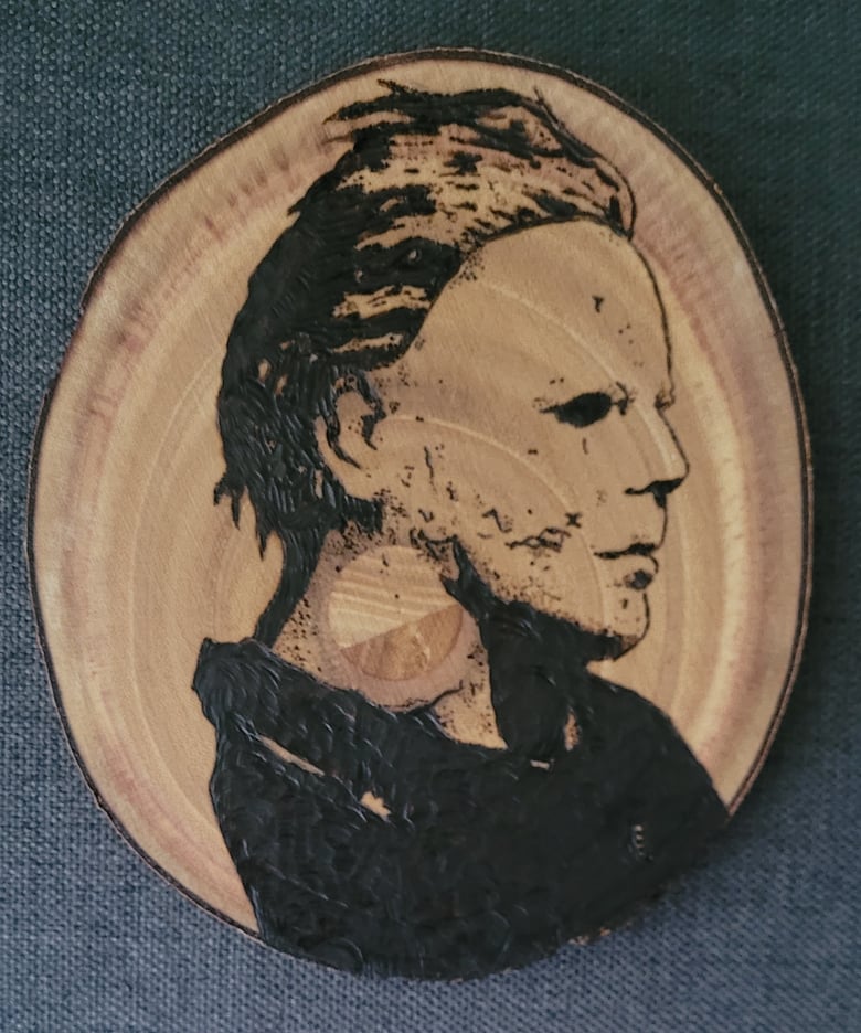 Image of Mike Myers wood burning piece 