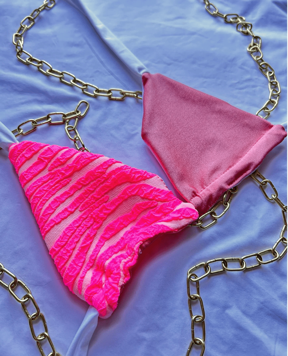 Image of the fuchsia wild pink zebra & glossy pink reversible bikini top