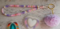Image 2 of White, pink and purple wristlet 