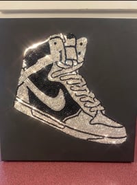 “Black Nike Tennis Shoe”