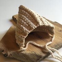 Image 1 of crochet cotton jersey bonnet.
