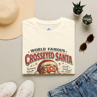 Image 1 of Crosseyed Santa T-Shirt — Retro 'World Famous' Holiday Graphic Tee