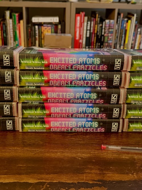 Image of Excited Atoms / Dream Particles RED VHS Tape