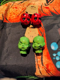 Image 1 of Horror doll head earrings 