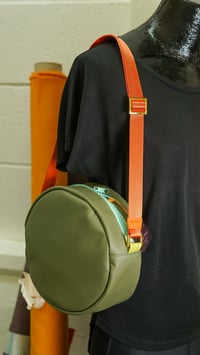 Image 1 of Winnie Handbag in Green Vinyl with Orange Strap