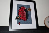 Anatomical 3d heart with arrow, framed.