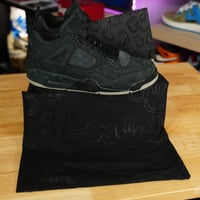 Image 2 of KAWS X Air Jordan 4