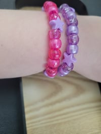 Image 3 of Purple & pink star 2 piece bracelets set