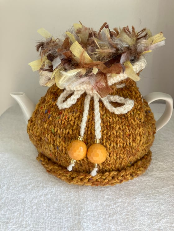 Image of small MUSTARD YELLOW Go On! tea cosie