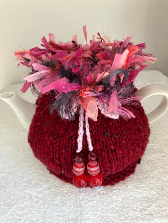 Image of small RED Go On! tea cosie