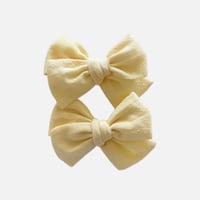 Woven yellow bows